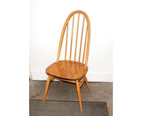 A set of four Ercol stick back dining chairs