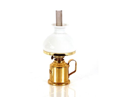 A Sorenson Denmark brass hand held oil lamp with white opaque shade 