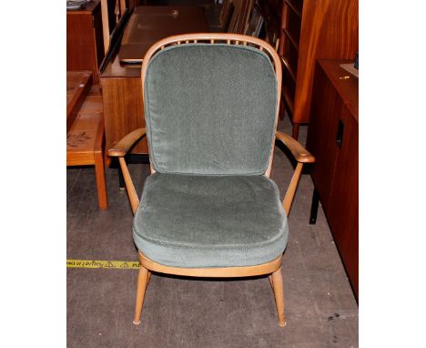 A pair of Ercol stick back cottage armchairs 