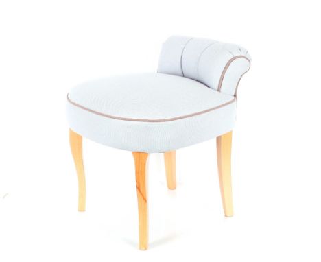 A light blue upholstered dressing table chair, raised on cabriole supports 