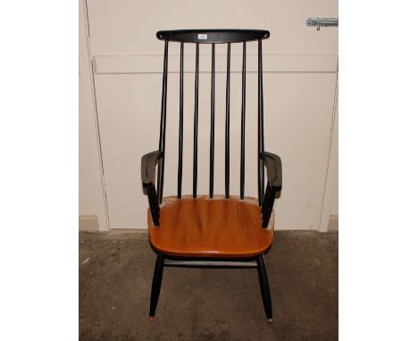 An elm seated and part painted stick back elbow chair, raised on turned stretchered supports 