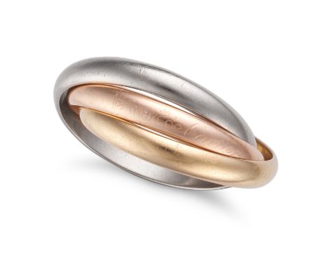 LES MUST DE CARTIER, A TRINITY RING in 18ct gold and platinum, comprising three interlocking bands, signed Les Must de Cartie