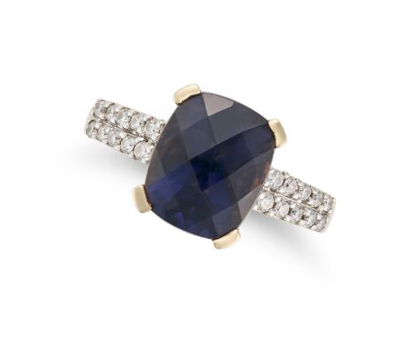 AN IOLITE AND DIAMOND DRESS RING set with a fancy cut iolite, the band set with two rows of round cut diamonds, stamped 14K, 