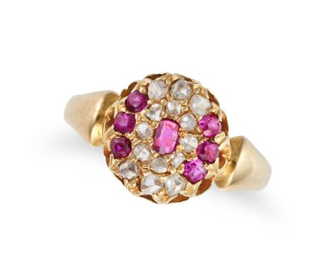 AN ANTIQUE RUBY AND DIAMOND CLUSTER RING in yellow gold, set with a cushion cut ruby in a cluster of rose cut diamonds and fu