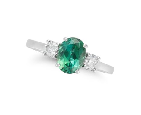 A GREEN TOURMALINE AND DIAMOND THREE STONE RING set with an oval cut green tourmaline accented on each side by a round brilli