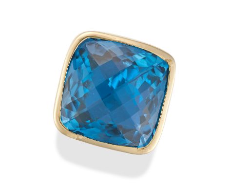 A BLUE TOPAZ AND DIAMOND RING set with a fancy cut blue topaz of 37.60 carats, the shoulders set with round cut diamonds, sta