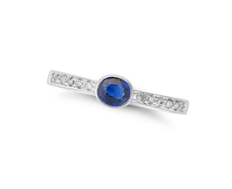 A SAPPHIRE AND DIAMOND RING set with an oval cut sapphire accented by round cut diamonds, stamped 14K, size L1/2 / 6, 1.7g. 