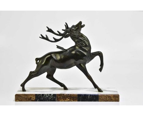 A large Art Deco bronzed spelter model of a stag with arrow through its back, on a marble plinth base, length 40cm.