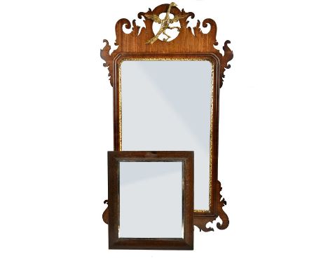 A Chippendale style walnut fret carved wall mirror, 89 x 48cm and a small oak framed bevelled mirror (2).