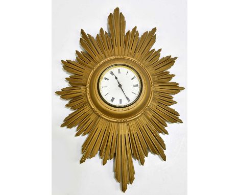 A 1920s/30s Art Deco gilt sunburst wall clock, the enamel dial set with Roman numerals, width 46cm.Condition Report: Numerous