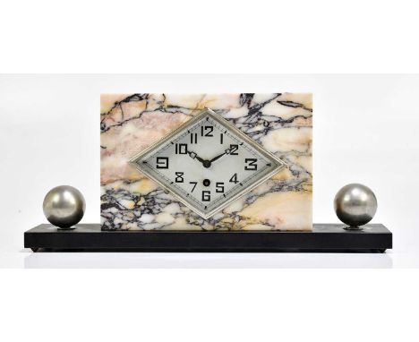 An Art Deco marble and slate mantel clock, the silvered dial set with Arabic numerals, flanked by a pair of silvered balls, l
