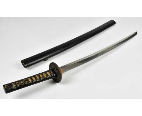 A Japanese long Wakizashi, the grip ends with yellow metal floral decorated Fuchi and Kashira, flanking the shagreen grip, wi