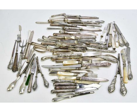A group of various hallmarked silver handled button hooks, together with some hallmarked silver handled cutlery.