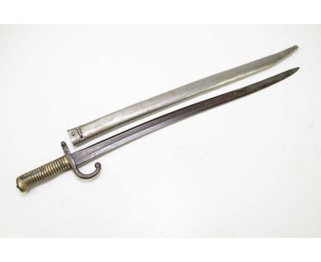 A chassepot bayonet with metal scabbard and brass grip, marked 'A7' and further stamped '10' to the grip, length of blade 57c