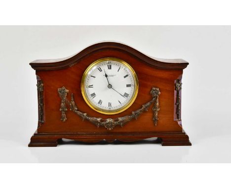 W. BATTY &amp; SONS LTD; an early 20th century mahogany mantel clock, the arched top above the circular enamelled dial set wi