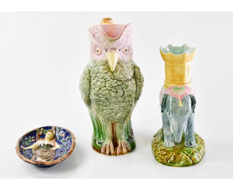 A 19th century majolica jug modelled as a cocktaoo, height 26cm, together with a majolica model of an elephant, height 21cm a