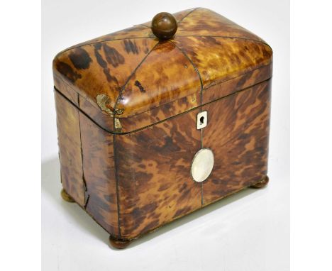 A George III tortoiseshell tea caddy of shaped square form, the hinged cover enclosing two compartments, with white metal esc