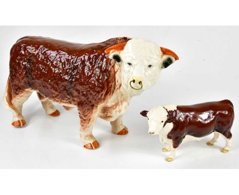 BESWICK; a model of a Hereford bull, length 22cm, together with a large ceramic model of a Hereford bull, originally from a b