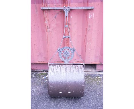 A cast iron garden roller.