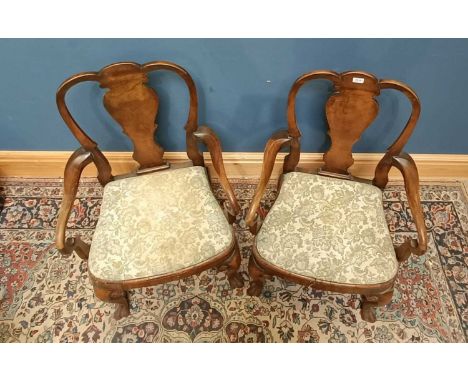 Four 19th century walnut Queen Anne style carvers, with floral tapestry seats (4).