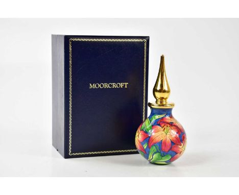 MOORCROFT; an enamel perfume bottle, with brass stopper, height 12cm, boxed.Condition Report: Appears to be in good condition
