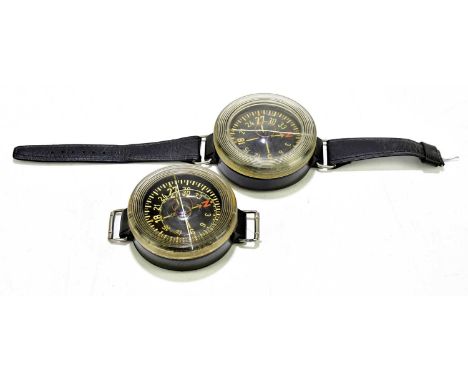 A German Luftwaffe armband compass, no.10154485, with replacement strap, together with a further example (lacking strap) (2).