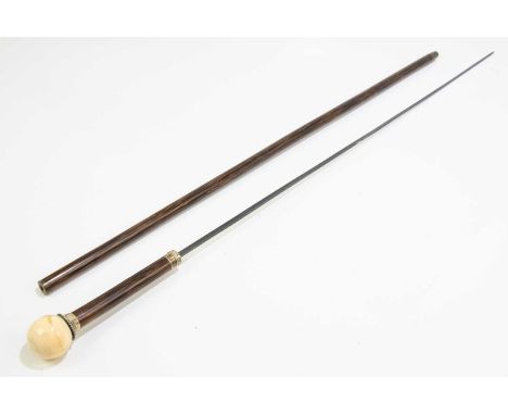 A Victorian bamboo white metal mounted sword stick with ivory pommel and brass tip, stamped to the collar 'WM', overall lengt