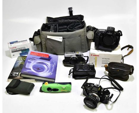 A small collection of assorted cameras and accessories, including Polaroid, Polaroid-I-Zone, Canon EOS5, Canon IXUSZ70, a pai