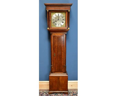 A George III oak and mahogany crossbanded thirty hour longcase clock, the square brass dial set with silvered chapter ring in