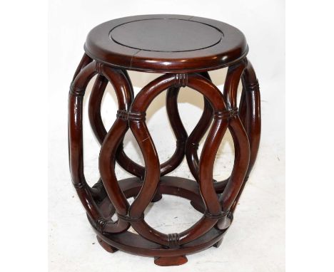 A Chinese rosewood garden seat, height 44cm, diameter 31cm.