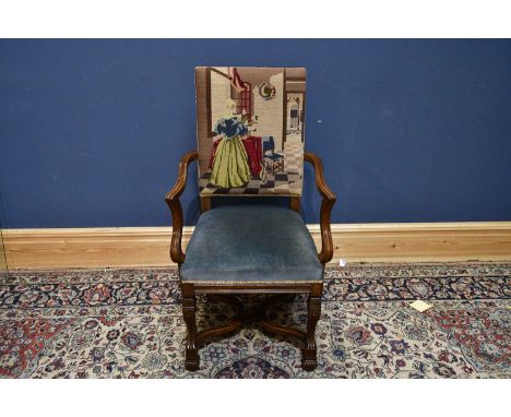 A Carolean elbow chair with tapestry back.