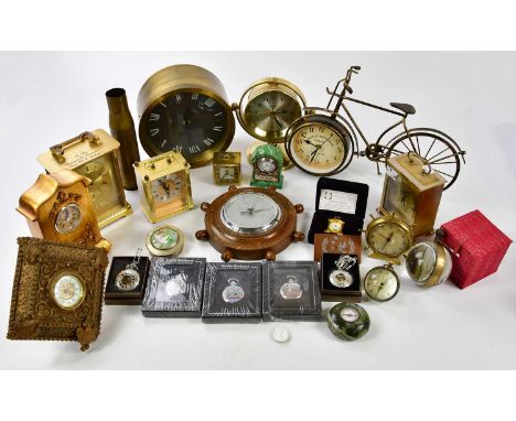 A collection of reproduction brass cased mantel clocks, to include a novelty bicycle clock and reproduction ship's wheel baro
