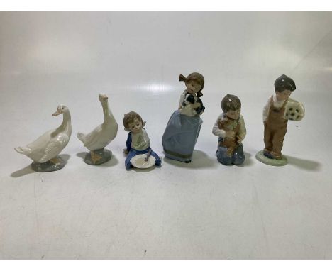 Nao; six ceramics figures, to include 01127 'Boy Kneeling', 01029 'Girl Holding a Puppy', 01068 'Boy with Football', etc, eac