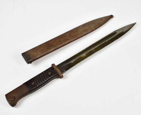 A WWII K98 German bayonet and scabbard, marked 1940 with bakerlite grips.