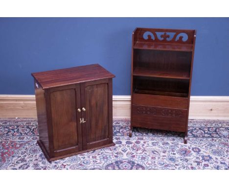 A mahogany two door medicine cabinet enclosing a single fixed shelf, together with a mahogany magazine shelf, with pull-down 