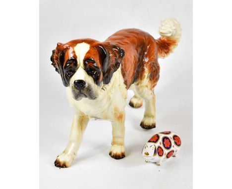 GOEBEL; a large model of a St Bernard, height 28cm, length 45cm, together with a Royal Crown Derby animal form paperweight mo