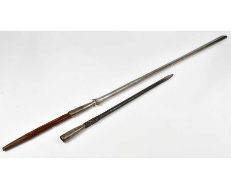 A Maasai spear, length 126cm, with an unusual cast metal spearhead (2)