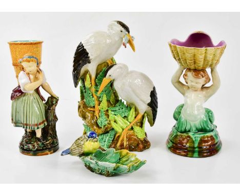 MINTON; a 19th century majolica figure of a maiden holding a basket, height 21cm, together with a majolica model of merman ho