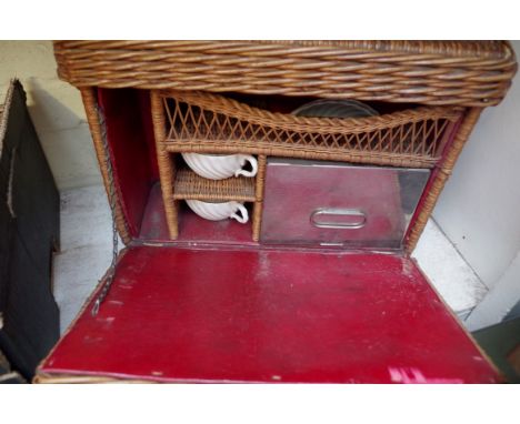 A vintage wicker motoring picnic set,&nbsp;the sandwich box inscribed 'Kirby Beard &amp; Co, Paris'. 