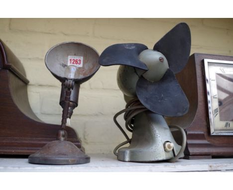 A vintage articulated desk lamp; together with a vintage GEC 8" fan.&nbsp; 