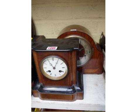 A 1930s walnut and inlaid mantel clock,&nbsp;27cm wide; together with another late Victorian walnut and ebonized example.&nbs