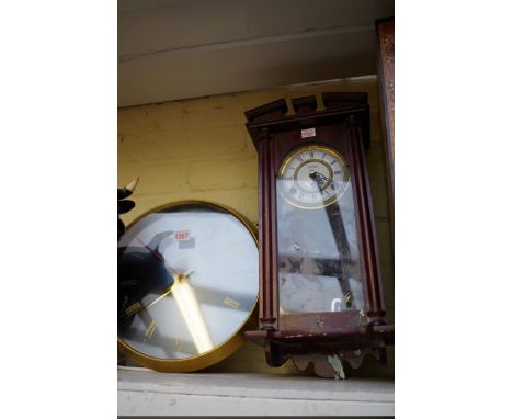 A small mahogany wall clock,&nbsp;with enamel dial, 45cm high, with pendulum; together with a vintage Gibson brass electric w