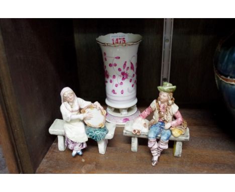 A Meissen spill vase,&nbsp;14.5cm high; together with a pair of Continental pottery figures.&nbsp; 