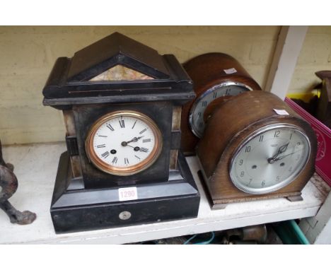 A Victorian slate and marble mantel clock,&nbsp;31cm high; together with two oak mantel clocks.&nbsp; 
