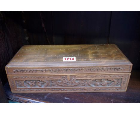 An eastern carved wood box, with cribbage board top, 30.5cm wide. 