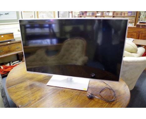 A Panasonic TX-L42E6B television,&nbsp;with remote control, (light surface scratches to screen). 