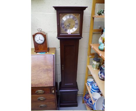 A reproduction Metamec&nbsp;mahogany small longcase clock,&nbsp;153cm high, with pendulum.&nbsp; 