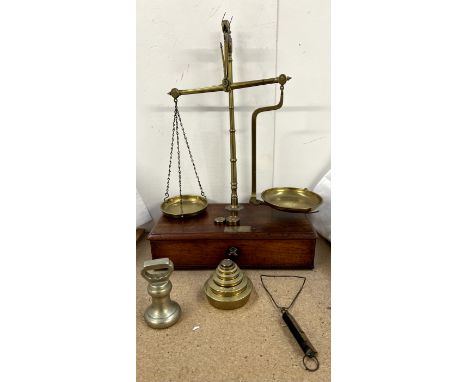 A mahogany and brass two pan scales, with weights etc 