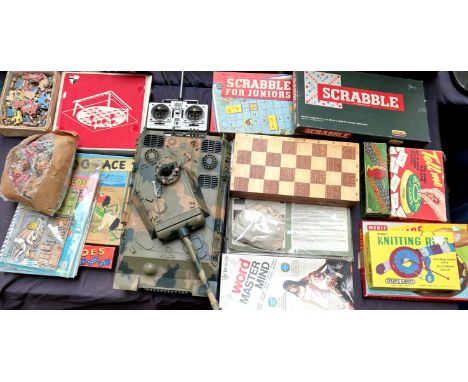 Assorted board games including Scrabble, dominoes, knitting ring, Mastermind, etc together with a German Panther model etc 