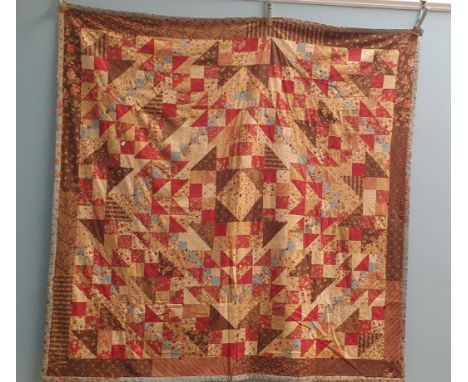 A modern patchwork quilt - A Jacob's Ladder quilt, a machine pieced quilt tied with buttons 81" x 80", finished with a hand s